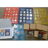 A collection of commemorative coins including 8 x 1973 50p EEC coins, boxed and three display