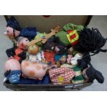 A suitcase containing a collection of fourteen Pelham puppets