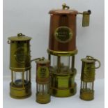 Four small miner's lamps, tallest 17cm
