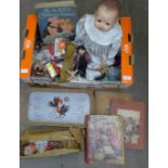 A box of assorted items including die-cast vehicles, Teddy bear, children's books, puppet etc.