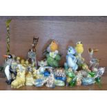 A collection of animal figures including Wade Whimsies, glass animals, two bird figures and Wade Tom