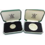 A The Royal Mint hallmarked silver National Trust medallion and one other National Trust medallion