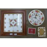 A Royal Albert Old Country Roses clock, two handled tray, picture frame and coasters **PLEASE NOTE