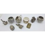 Two Persian white metal salts and a salt celler, an 800 silver napkin ring, (149g gross) a silver-