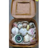 A collection of china pomanders (12) in a case **PLEASE NOTE THIS LOT IS NOT ELIGIBLE FOR POSTING