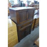 A carved oak cocktail cabinet