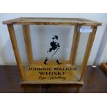 A light oak table top display case, bearing later Johnnie Walker Whisky inscription to glass