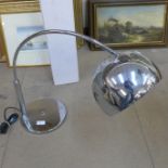 A chrome table lamp