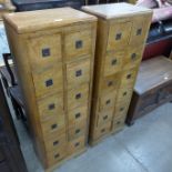 A pair of hardwood twelve drawer apothecary style chests