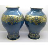 A pair of Royal Worcester vases, 23.5cm, one a/f