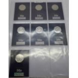 Seven 50p coins, all uncirculated on Change Checker cards including 2017 Peter Rabbit, 2020 Snowman,