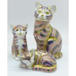 Three Royal Crown Derby Cat and Kitten paperweights, one gold and two silver stoppers