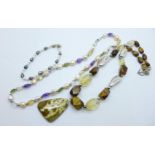 A silver mounted amethyst, cultured pearl and crystal necklace, one other necklace and a bracelet