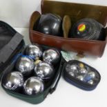 Two bowling woods and two sets of boules **PLEASE NOTE THIS LOT IS NOT ELIGIBLE FOR POSTING AND