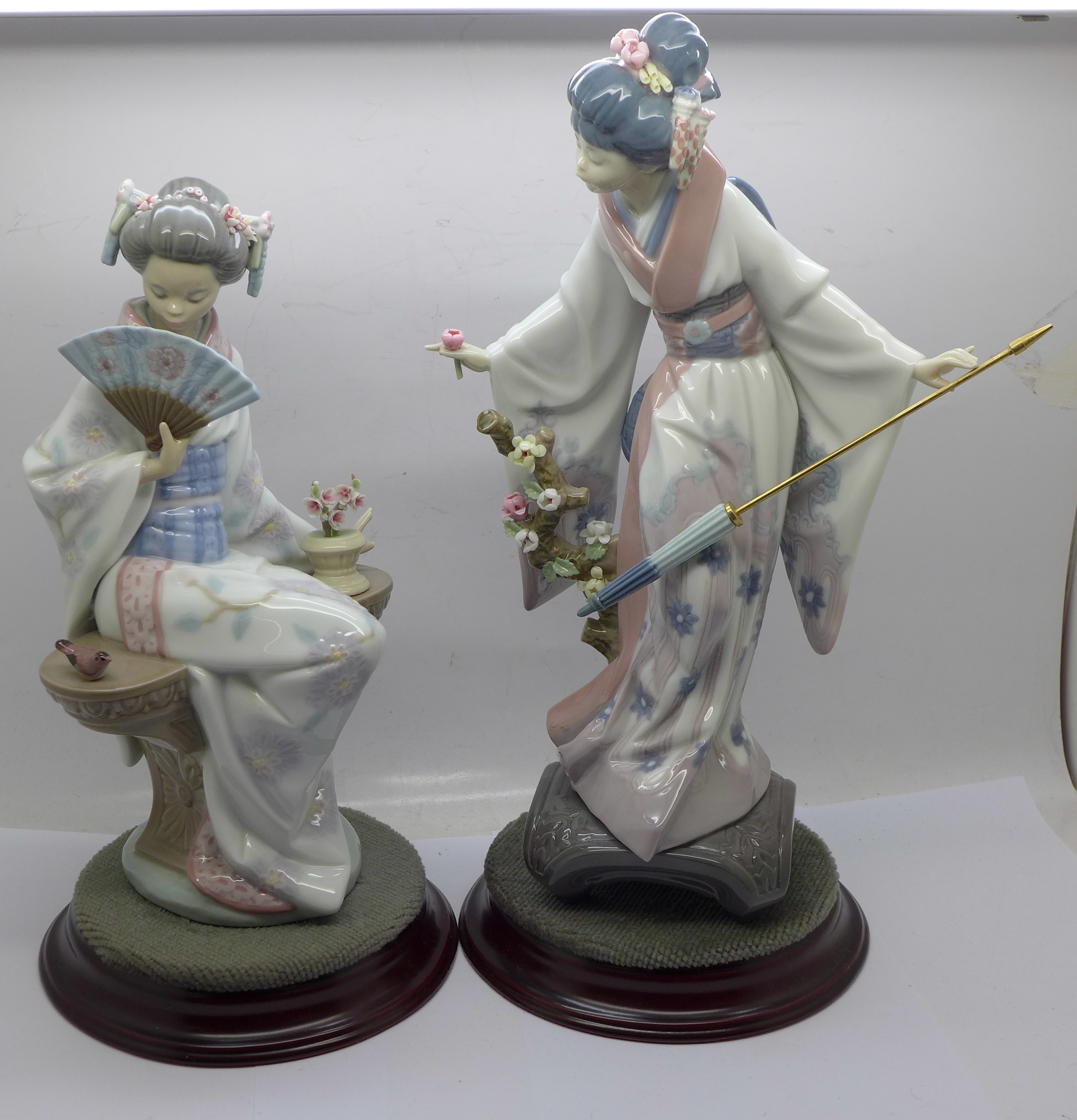 Two Lladro figures of Geisha girls on stands