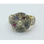 A yellow and white metal ring, set with 25 rose cut diamonds, emerald, ruby, garnet, sapphire,