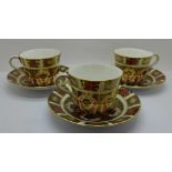 Three Royal Crown Derby 1128 pattern cups and saucers