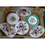 Nine items of Imari Ironstone, four green and three crimson edged plates with hand painted flowers