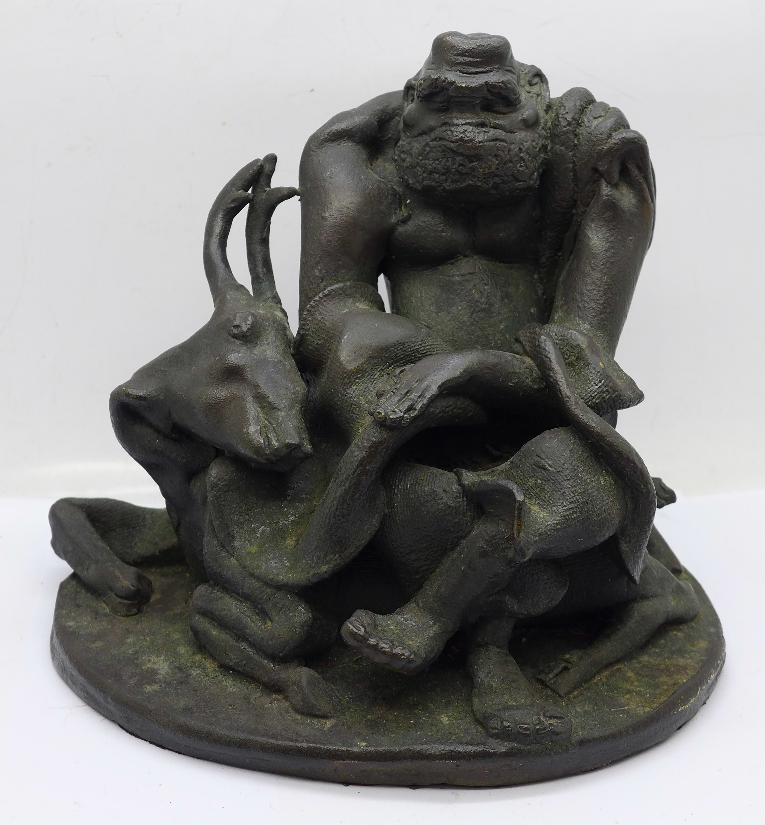 A Chinese bronze figure of an Elder on recumbent deer