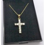 A silver gilt cross pendant and chain