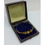 A c1900 9ct gold bangle, with case, 7.2g