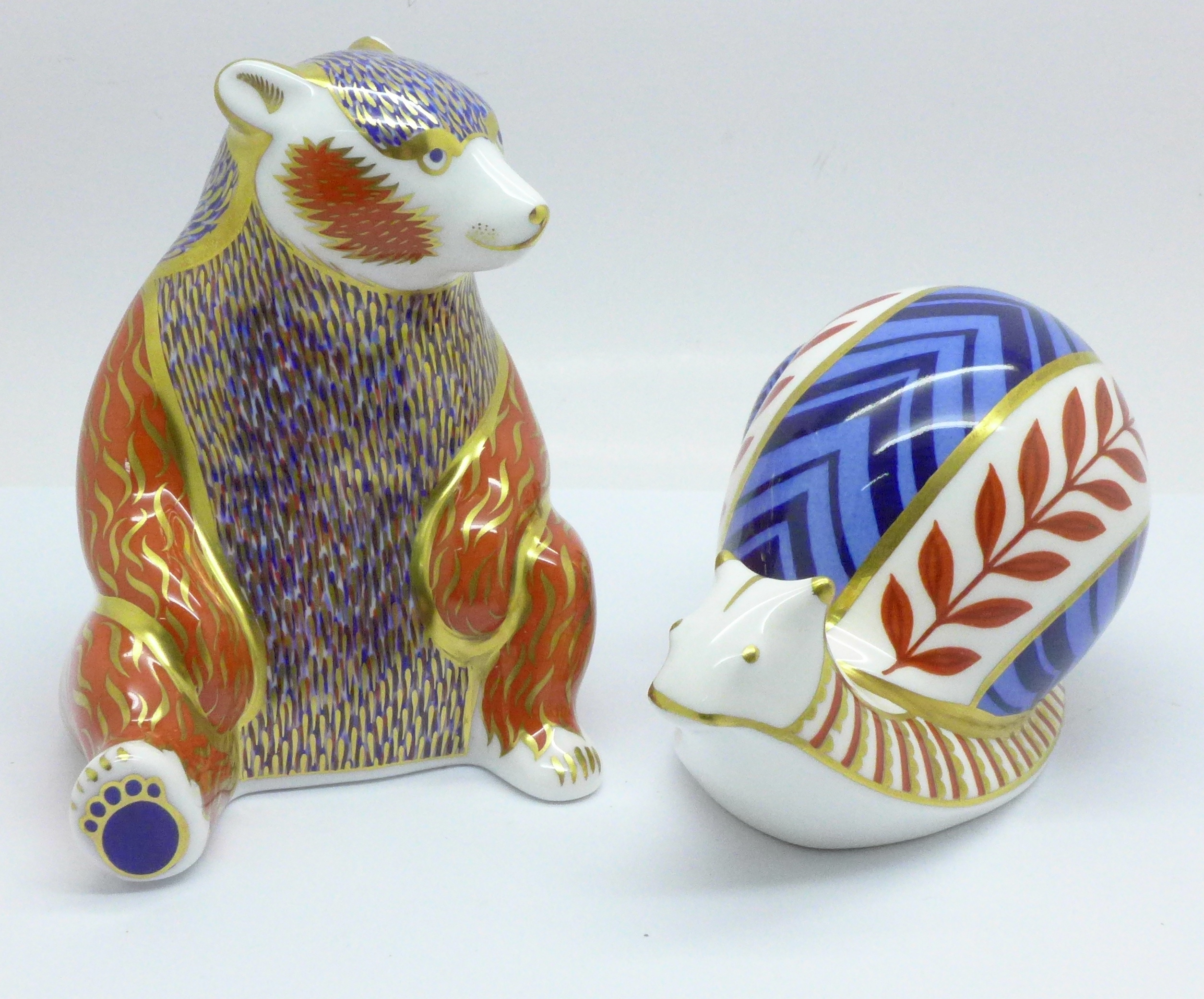 A Royal Crown Derby Honey Bear paperweight with silver stopper and a Royal Crown Derby Snail