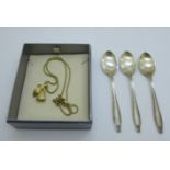 A Christian Dior pendant and chain and three silver spoons, spoons 37g