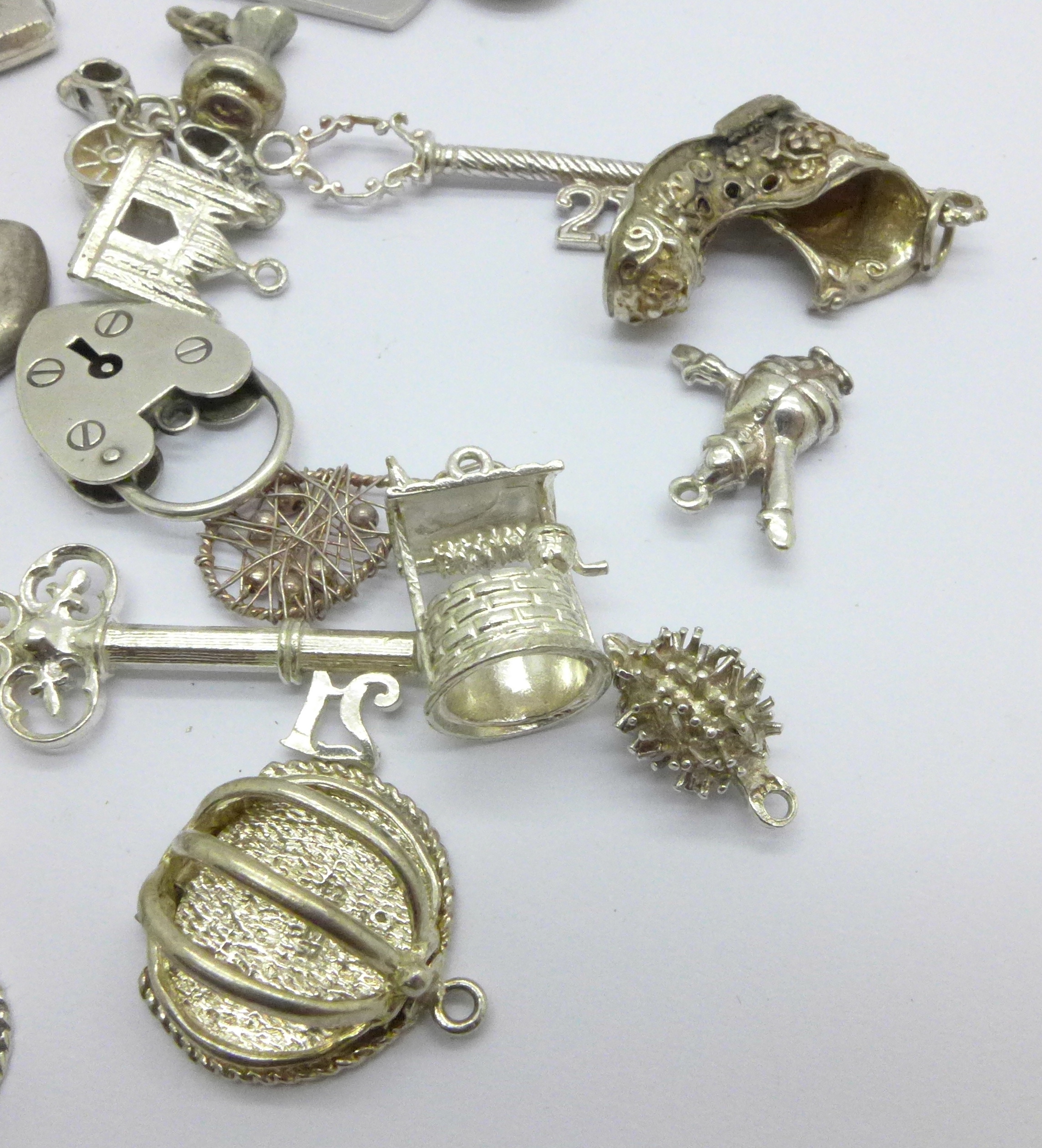A collection of silver and white metal charms, total weight 83g, one locket marked 'SIL BK-FT' - Image 5 of 5