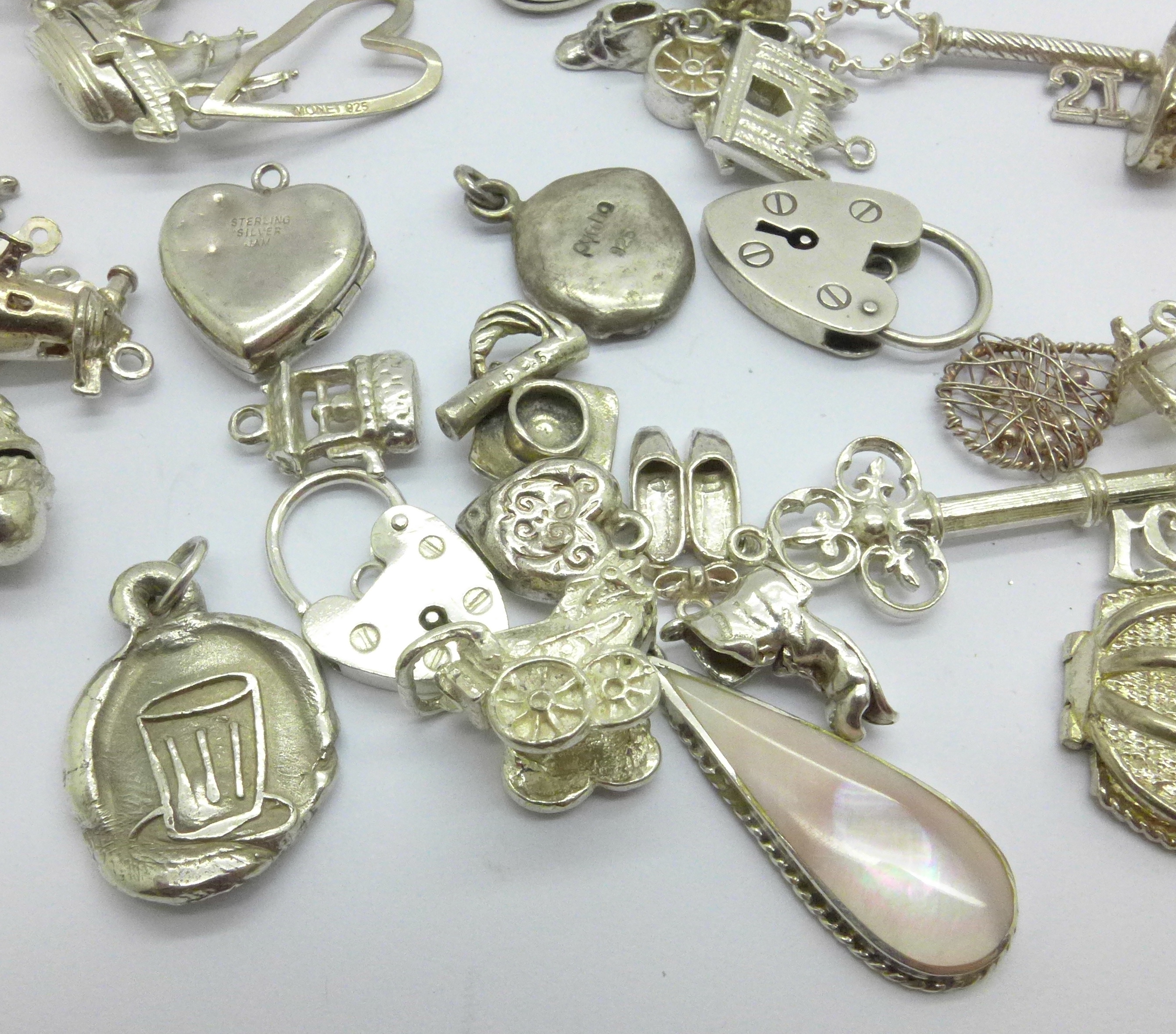 A collection of silver and white metal charms, total weight 83g, one locket marked 'SIL BK-FT' - Image 3 of 5