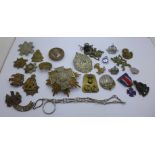 A collection of military cap badges and uniform buttons, etc., and a 1939-45 RAF Benevolent Fund