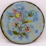An enamelled and hand decorated plate, reverse marked B Samah, Atelier Cezanne, Marseille, France,
