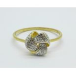 A silver gilt knot ring with diamond accent, T