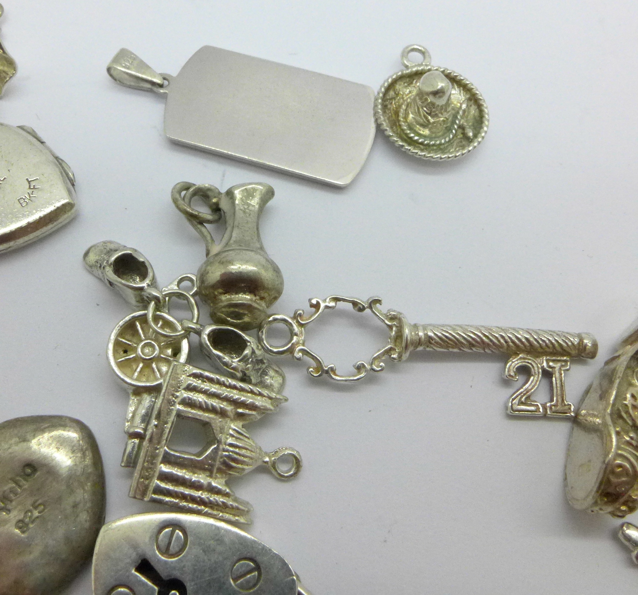 A collection of silver and white metal charms, total weight 83g, one locket marked 'SIL BK-FT' - Image 4 of 5