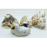 Four Royal Crown Derby paperweights, Twin Lambs and Meadow Rabbit with gold stopper, boxed, and
