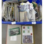 A large collection of postcards and stamps