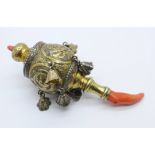 A Victorian silver gilt and coral rattle, tests as silver
