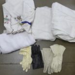 Four pairs of vintage leather gloves, two table cloths, a tray cloth, a Victorian christening robe