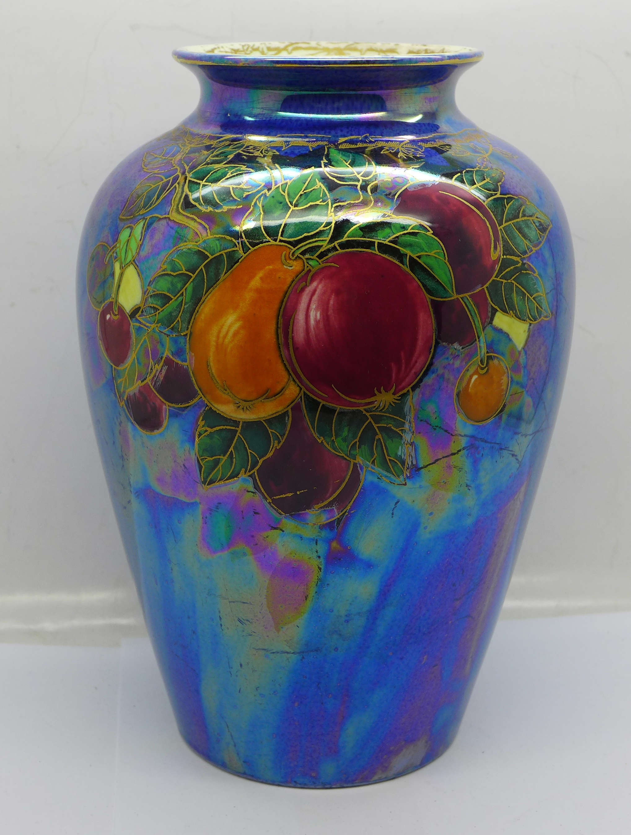 A Crown Devon lustre vase decorated with fruit, 20cm