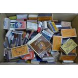 A collection of vintage matchboxes and matchbooks