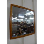 A Danish teak framed bevelled mirror