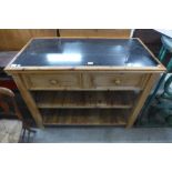 A Victorian style pine and granite topped kitchen serving table