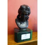 A small French style bronze bust of a lady, on green marble socle, 16cms h