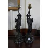 A pair of French style bronze figural table lamps, manner of Moreau, on faux marble socles, 55cms h