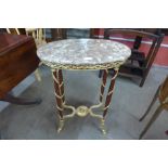 A French Louis XV style mahogany, gilt metal and marble topped oval gueridon table