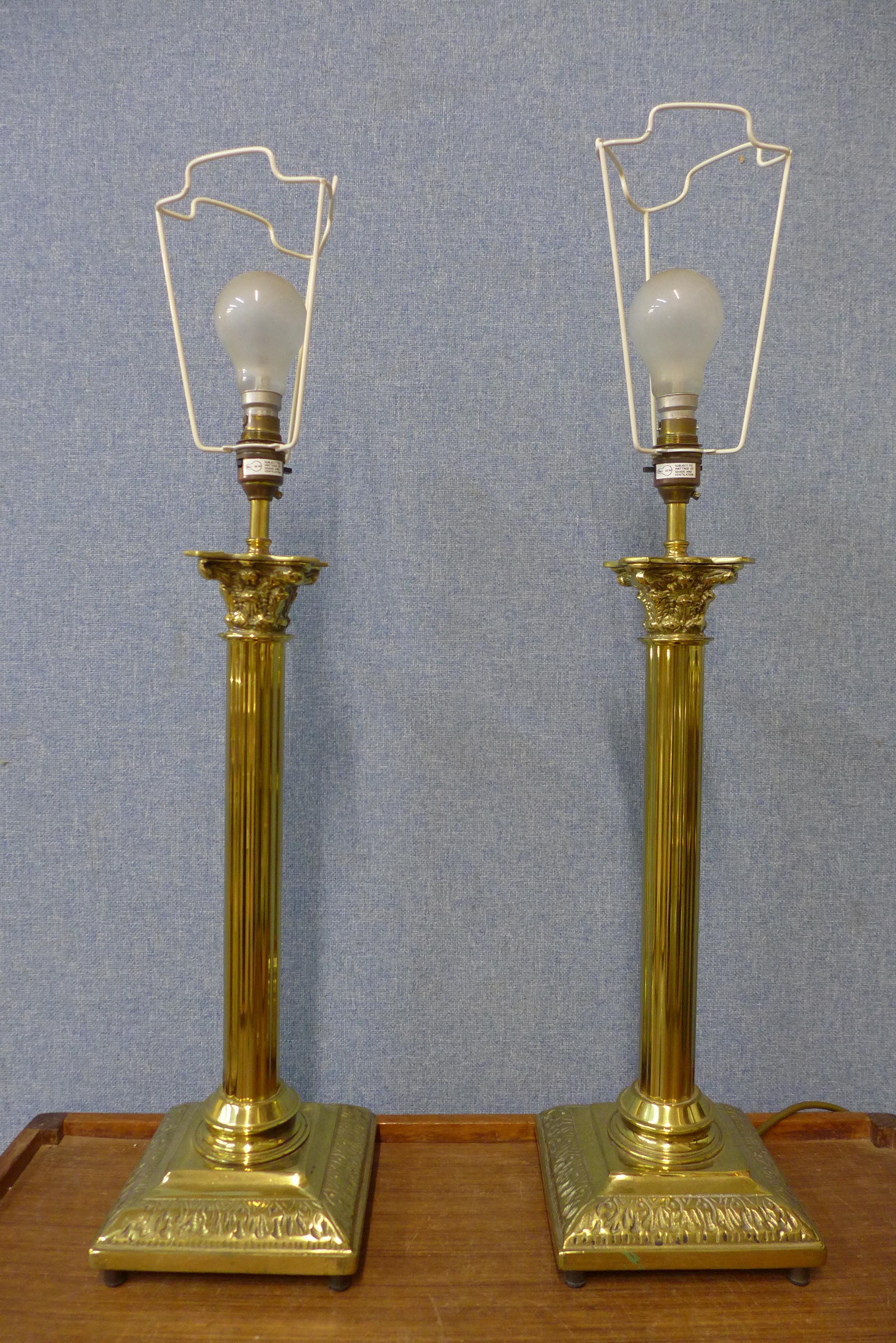 A pair of brass Corinthian column table lamps