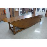 An extremely large George III style Ipswich oak double action gateleg wake table, 76cms h, 397cms l,