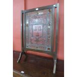 An Arts and Crafts mahogany and leaded glass armorial fire screen, painted with Whalley Family,