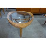 A Nathan teak and glass topped triangular coffee table