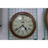 A beech cased circular wall clock, dial bearing Railway Regulator inscription