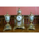 A French style Imperial gilt metal and porcelain clock garniture